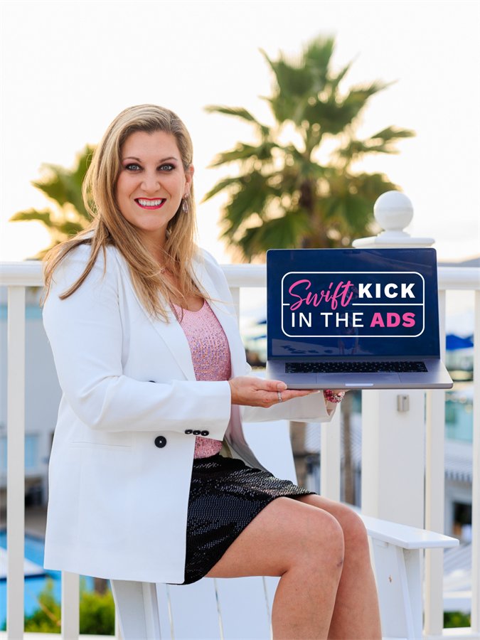 Amanda Robinson holding a tablet showing the Swift Kick in the Ads logo