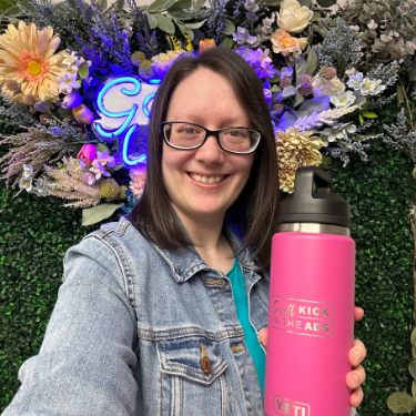 Member Kaylah with her Swift Kick in the Ads bottle