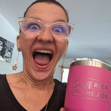 Member Yvi with her Swift Kick in the Ads mug