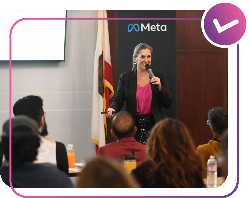 Amanda Robinson speaking to a room of business owners at a Meta event