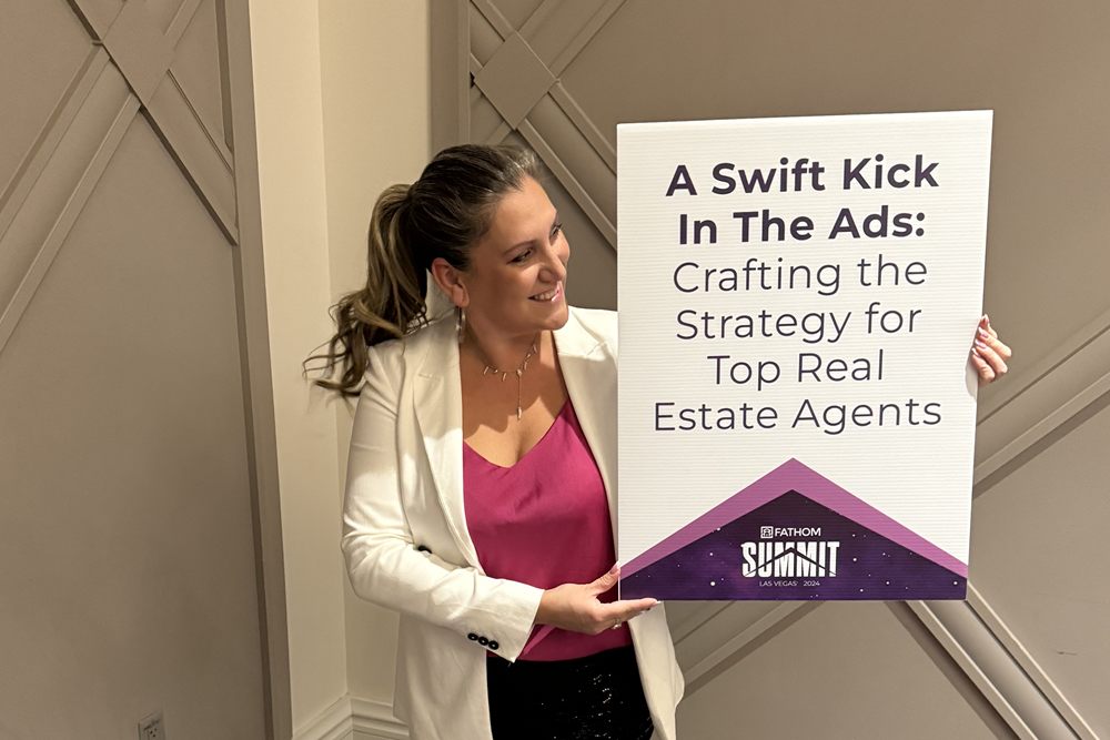 Amanda holding her "A Swift Kick In The Ads" session sign at the Fathom Summit in Las Vegas
