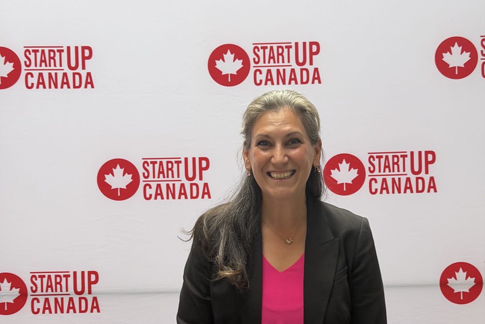 Amanda in front of the Startup Canada Tour backdrop