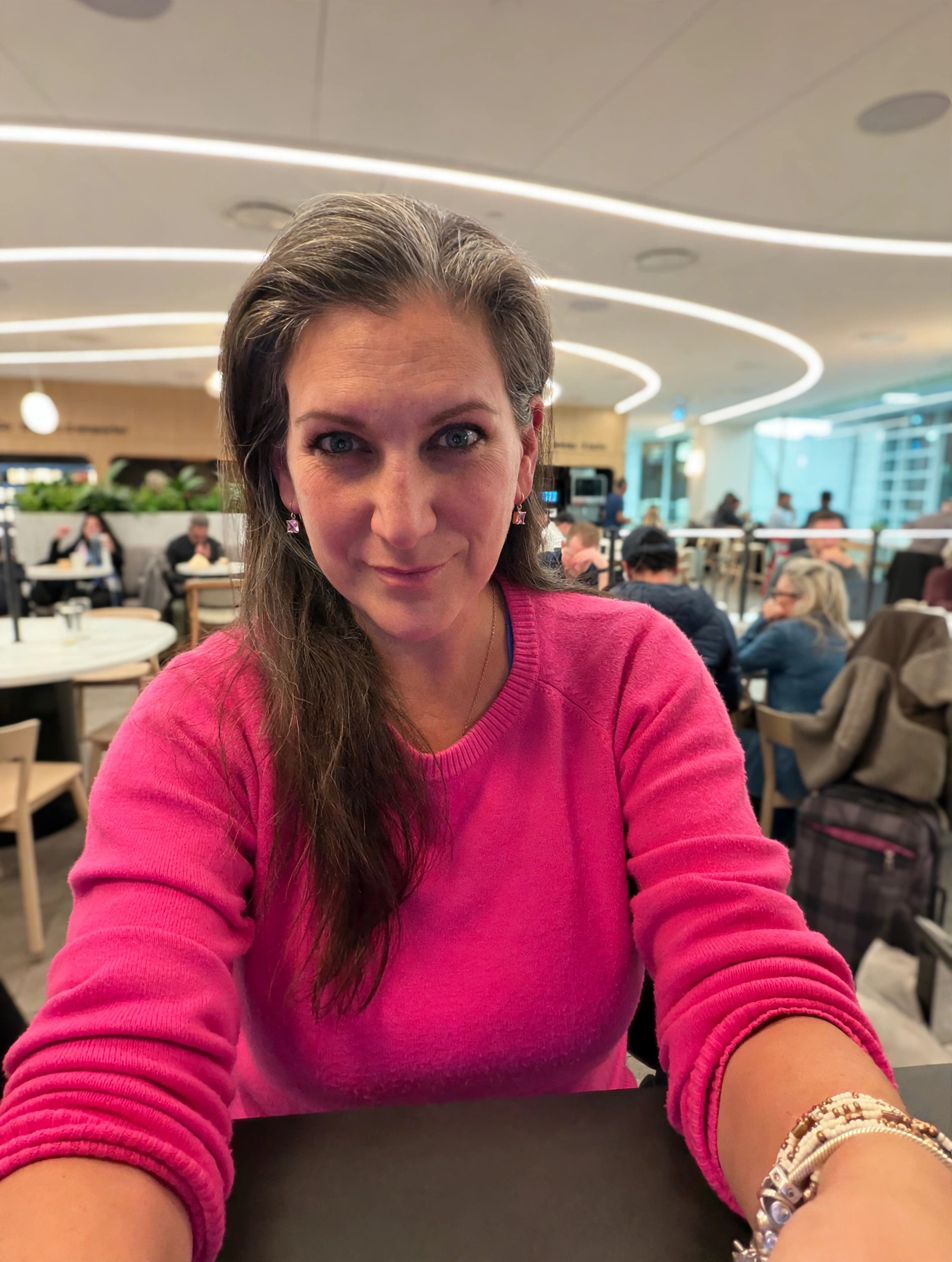 Amanda in the Air Canada lounge at YVR, typing this post